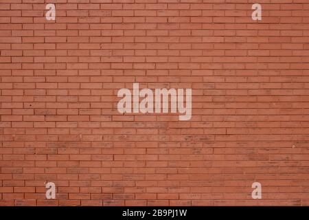 Antique burnt orange color brick wall texture background with aging scuffed surface Stock Photo