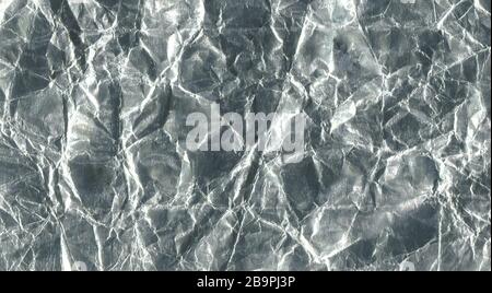 Shiny metal silver foil. Silver gray foil texture background. Metal shiny luxury abstract wallpaper Stock Photo