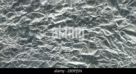 Shiny metal silver foil. Silver gray foil texture background. Metal shiny luxury abstract wallpaper Stock Photo