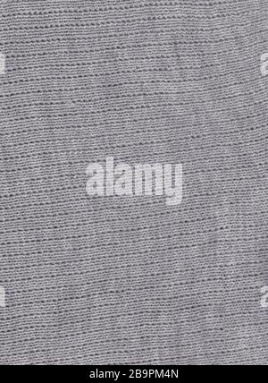Knitted gray  wallpaper and an abstract background. Stock Photo
