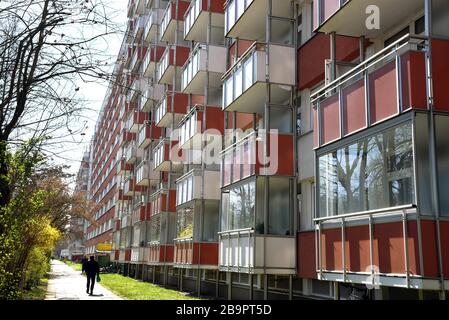 24 March 2020, Saxony, Leipzig: Few people walk along one of the longest apartment blocks in Germany, the 'Lange Lene' in the southeast of Leipzig. In the 335-metre-long prefabricated building of the Leipziger Wohnungsbaugesellschaft, employees of the association 'Alter, Leben und Gesundheit' look after over 200 elderly people, also as a small family substitute. In order to ensure that lunch is available because the cafeteria is now closed, some of them have their freshly cooked lunch brought into the apartments. Shopping in the supermarket, postal services and garbage disposal are also done d Stock Photo
