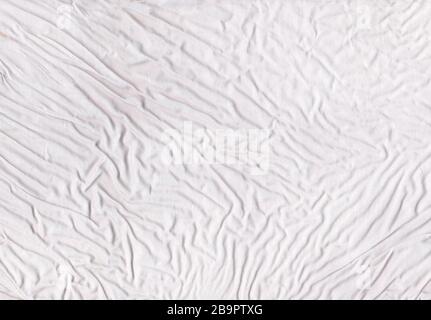 Light cloth textile texture background. White crumpled background Stock Photo