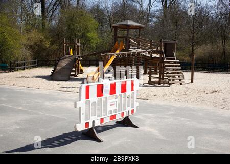 Playground, barrier, sign of playground closed due to corona virus, forbidden to enter, Germany, Europe Stock Photo