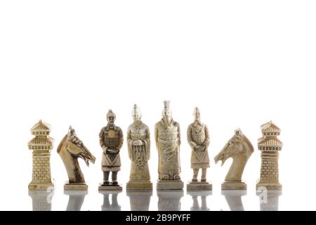 Close up photo of chess pieces isolated on a white background. Vintage asia style. Stock Photo