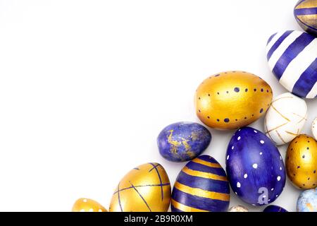 Happy Easter. Frame for text made of easter eggs trendy colored classic blue, white and golden on white. Minimal style, top view, flatlay, copy space. Stock Photo