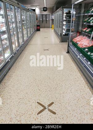 Glasgow, UK. 25th Mar, 2020. Distancing measures introduced in a local Cooperative store in New Gorbals showing markers on the floor indicating 2m distance, as well as limits on the number of items available to buy, Glasgow, UK Credit: Alamy News/Pawel Pietraszewski Credit: Pawel Pietraszewski/Alamy Live News Stock Photo