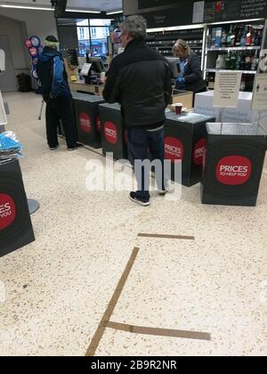 Glasgow, UK. 25th Mar, 2020. Distancing measures introduced in a local Cooperative store in New Gorbals showing markers on the floor indicating 2m distance, as well as limits on the number of items available to buy, Glasgow, UK Credit: Alamy News/Pawel Pietraszewski Credit: Pawel Pietraszewski/Alamy Live News Stock Photo