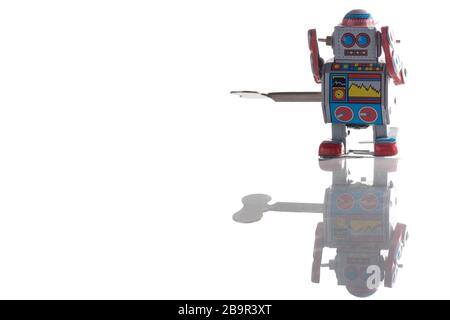 Vintage toy robot isolated on white background Stock Photo