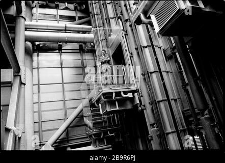 City of London. Lloyd’s of London Insurance trading floor photographed with permission in 1988. Lloyd's of London, generally known simply as Lloyd's, is an insurance and reinsurance market located in London, United Kingdom. Unlike most of its competitors in the industry, it is not an insurance company; rather, Lloyd's is a corporate body governed by the Lloyd's Act 1871 and subsequent Acts of Parliament. It operates as a partially-mutualised marketplace within which multiple financial backers, grouped in syndicates, come together to pool and spread risk. These underwriters, or 'members', are a Stock Photo