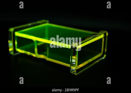 abstract green transparent plastic box dark background Stock Photo
