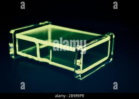 abstract transparent plastic box dark background Stock Photo