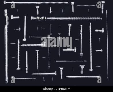 various size and type of screws arranging at 90 degree angles from each other on black background, monochromatic Stock Photo