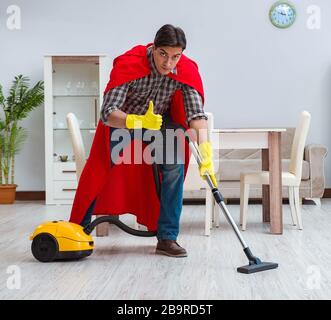 The super hero cleaner working at home Stock Photo