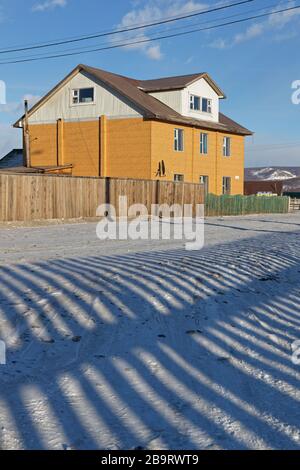 KHATGAL, MONGOLIA, March 1, 2020 : Khatgal streets in winter. The small town is known as one of the coldest cities in Mongolia but it owes its recent Stock Photo