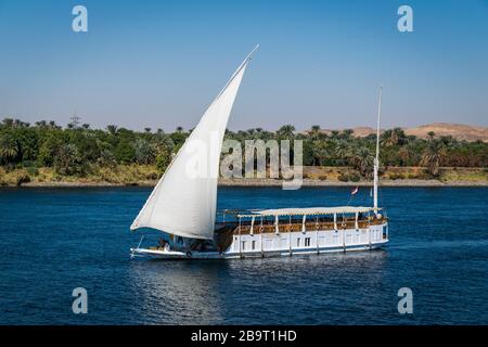 Large luxury traditional Egyptian river cruise boat sailing on the Nile ...
