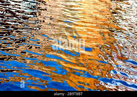 Vibrant colours reflected in water on a bright summers day in England, UK Stock Photo