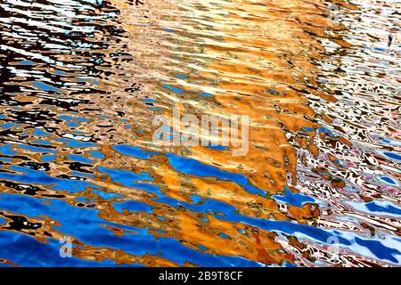 Vibrant colours reflected in water on a bright summers day in England, UK Stock Photo