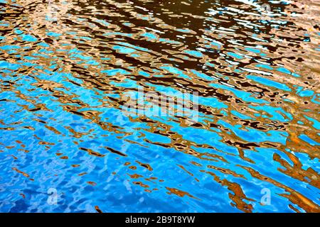 Vibrant colours reflected in water on a bright summers day in England, UK Stock Photo