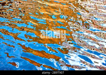 Vibrant colours reflected in water on a bright summers day in England, UK Stock Photo