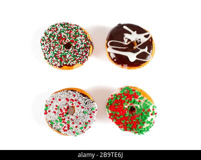 Sweet donuts with sprinkel on white background. Christmas donuts Stock Photo