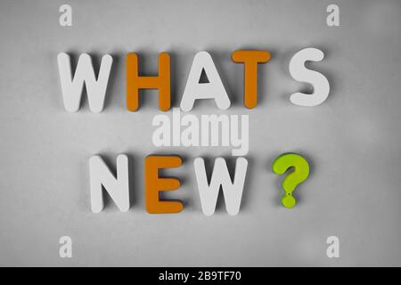 Whats new ? word written with different colored letter blocks arranged on a white background Stock Photo
