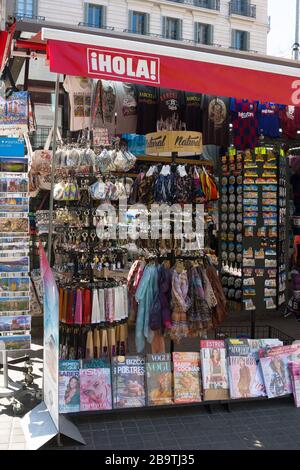 Barcelona, Spain - February 23, 2020: Traditional kiosc with cheap souvenirs for tourists, magazines and newspapers Stock Photo