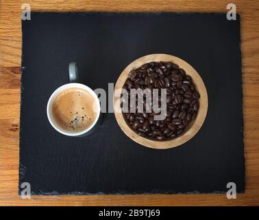 Sumatra Mandeling coffee beans and a cup of fresh coffee