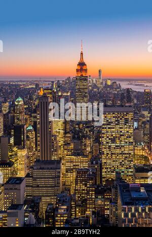 Midtown Manhattan skyline with Empire State Building at dusk, New York, USA Stock Photo