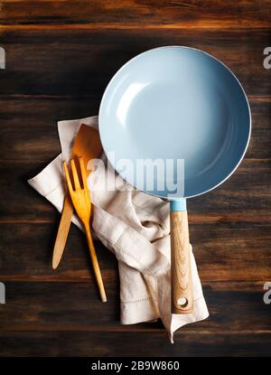 Empty cooking pan on wooden background, top view, copy space Stock Photo