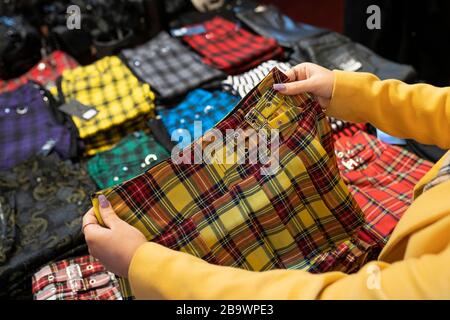 Yellow tartan kilt for sale in tartan shop. Stock Photo