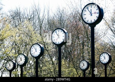 Controversial weekend time change. Clock installation Zeitfeld by Klaus Rinke at the northern entrance of the Volksgarten in Düsseldorf. Stock Photo