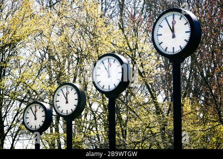 Controversial weekend time change. Clock installation Zeitfeld by Klaus Rinke at the northern entrance of the Volksgarten in Düsseldorf. Stock Photo