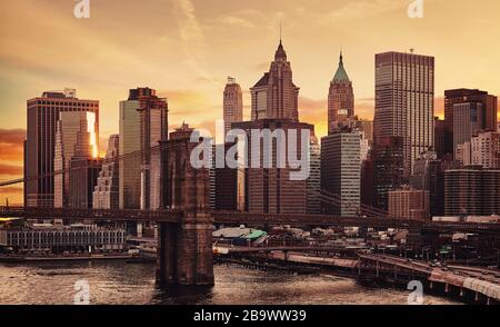 Manhattan and Brooklyn Bridge at sunset, color toning applied, New York City, USA. Stock Photo