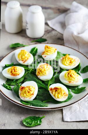 Deviled Eggs with Paprika as an Appetizer Stock Photo