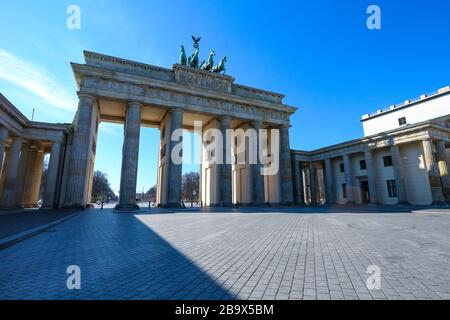 Brandenburg Gate in Berlin, usually a major landmark and tourist hotspot, is mostly deserted during Coronavirus lockdown in Germany. Stock Photo