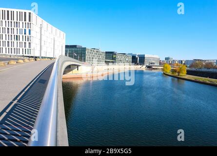 Bridge over Spree river in the deserted government district (german: 'Regierungsviertel') in central Berlin during coronavirus shutdown in Germany. Stock Photo