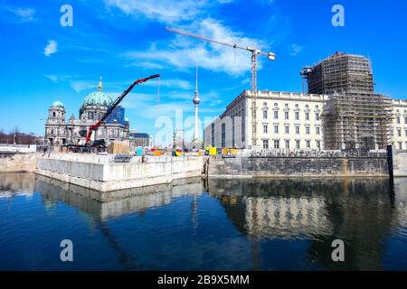 View over Spree river towards central Berlin, with TV Tower, construction cranes for work at the Cathedral and the Berlin Palace being reconstructed. Stock Photo