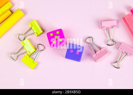 Multi-colored red yellow pinc pencils rulers, pens, pencils and scissors and stationery stand on a pink background Stock Photo