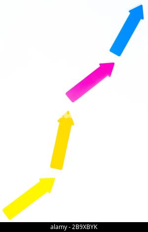 White sheet on which multicolored arrows show growth, success Stock Photo