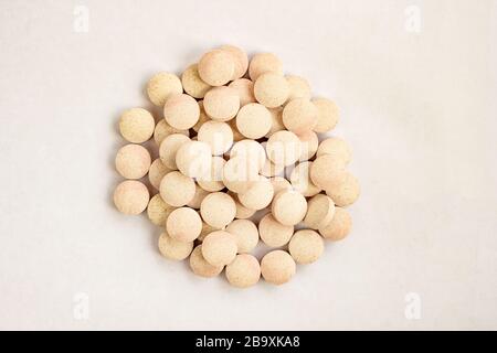 Medical lozenges cough relief, sore throat, throat irritation on white background. Herbal tablets. Stock Photo