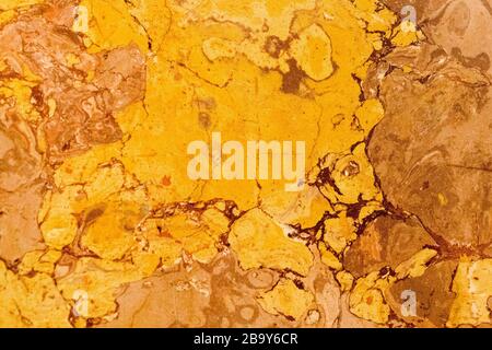 warm colored natural marble panel, natural beautiful marble in dark and warm colors, marble background texture, closeup Stock Photo