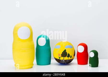 Wooden multi-colored toy nuts on white background, studio light Stock Photo