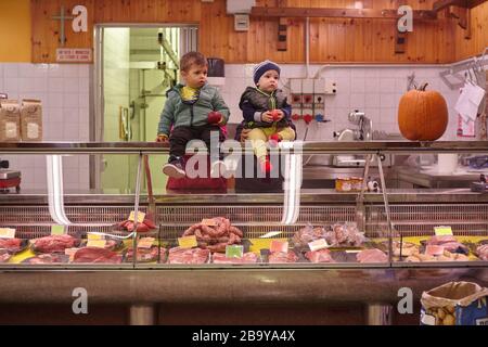 Children sitting on the fridge counter 3 Stock Photo
