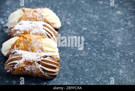 Sicilian cannoli stuffed with ricotta cheese. Cannoli Siciliani Stock Photo