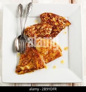 Traditional crepes with maple syrup Stock Photo