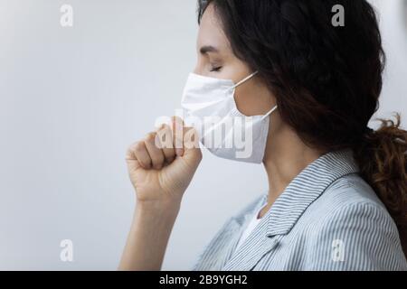 Unhealthy woman in medical mask suffer from coronavirus Stock Photo