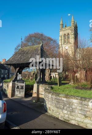 The lych gate and tower of the historic All Saints' parish church in Helmsley, North Yorkshire Stock Photo