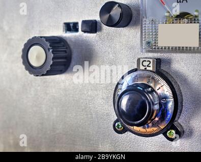 Front panel of a high frequency power amplifier with vacuum tubes close up view Stock Photo