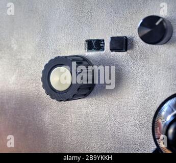Front panel of a high frequency power amplifier with vacuum tubes close up view Stock Photo