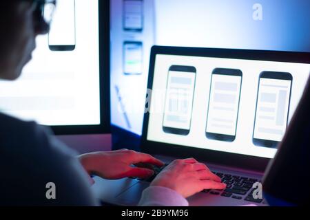 Designers create a user interface for mobile phones Stock Photo